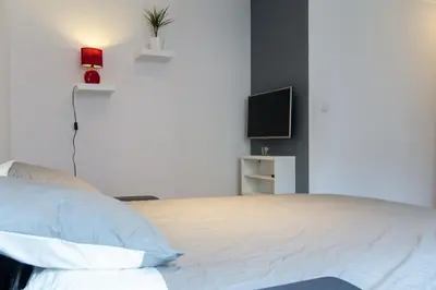 Un ou plusieurs lits dans un hébergement de l'établissement Sweet Home Dijon Nodot