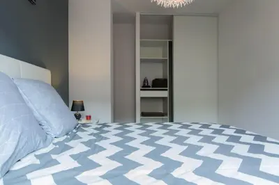 Un ou plusieurs lits dans un hébergement de l'établissement Sweet Home Dijon Nodot