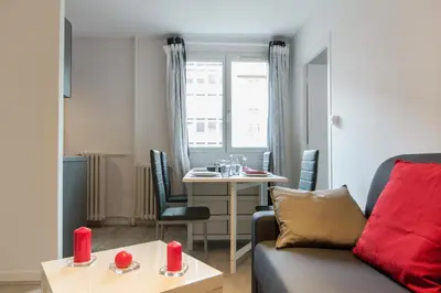Coin salon dans l'établissement Sweet Home Dijon Nodot