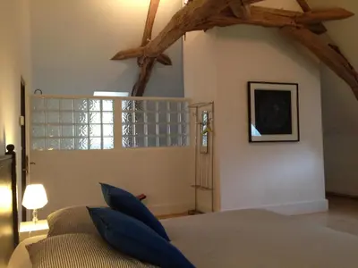 Un ou plusieurs lits dans un hébergement de l'établissement Les Chambres d'Hôtes du Bois Joli