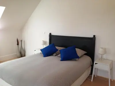 Un ou plusieurs lits dans un hébergement de l'établissement Les Chambres d'Hôtes du Bois Joli