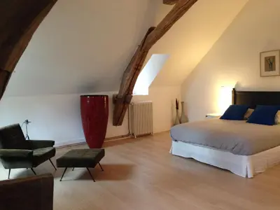 Un ou plusieurs lits dans un hébergement de l'établissement Les Chambres d'Hôtes du Bois Joli
