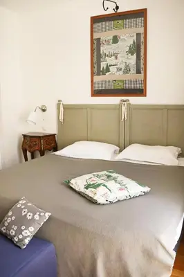 Un ou plusieurs lits dans un hébergement de l'établissement Logis Hôtel La Villa Boucicaut