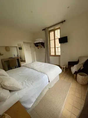 Un ou plusieurs lits dans un hébergement de l'établissement Auberge Côté Rivière