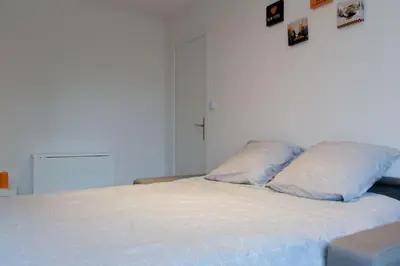 Un ou plusieurs lits dans un hébergement de l'établissement Sweet Home Dijon-Arquebuse
