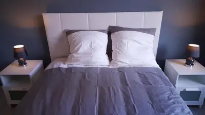 Un ou plusieurs lits dans un hébergement de l'établissement Sweet Home Dijon-Arquebuse