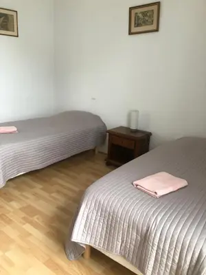 Un ou plusieurs lits dans un hébergement de l'établissement Gîte Les Minimes