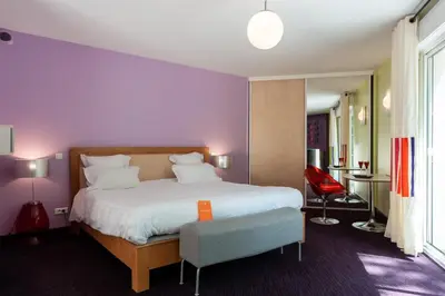 Un ou plusieurs lits dans un hébergement de l'établissement Hôtel La Gentilhommière