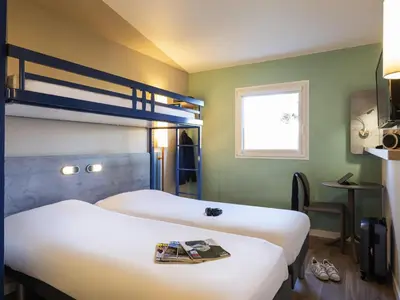Un ou plusieurs lits dans un hébergement de l'établissement ibis budget Nuits Saint Georges