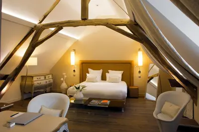 Un ou plusieurs lits dans un hébergement de l'établissement Maison Doucet - Relais & Châteaux