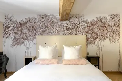 Un ou plusieurs lits dans un hébergement de l'établissement Maison Doucet - Relais & Châteaux