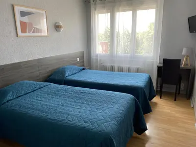 Un ou plusieurs lits dans un hébergement de l'établissement Hotel Restaurant Saint-Benoit