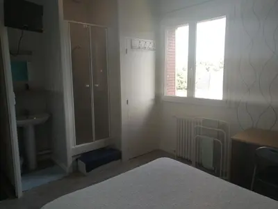 Un ou plusieurs lits dans un hébergement de l'établissement Auberge du Vieux Moulin