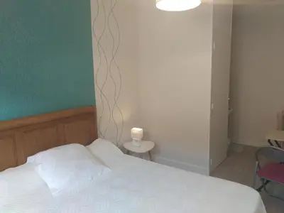 Un ou plusieurs lits dans un hébergement de l'établissement Auberge du Vieux Moulin
