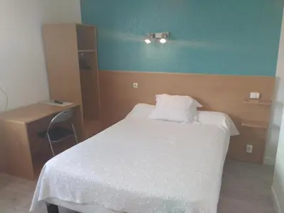 Un ou plusieurs lits dans un hébergement de l'établissement Auberge du Vieux Moulin
