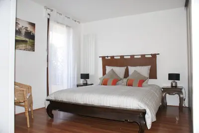 Un ou plusieurs lits dans un hébergement de l'établissement Appartement Le Louvre