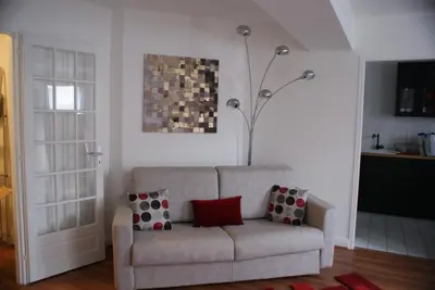 Coin salon dans l'établissement Appartement Le Louvre