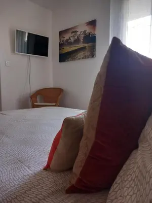 Un ou plusieurs lits dans un hébergement de l'établissement Appartement Le Louvre