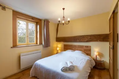 Un ou plusieurs lits dans un hébergement de l'établissement Gite Le Foineau - Maison avec Piscine