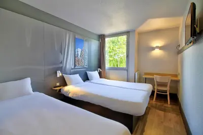 Un ou plusieurs lits dans un hébergement de l'établissement B&B HOTEL Beaune Sud 1 Palais des Congrès