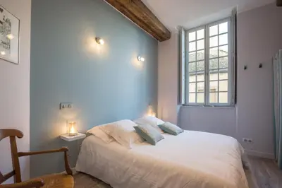 Un ou plusieurs lits dans un hébergement de l'établissement Beaune Sweet Home
