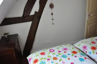 Un ou plusieurs lits dans un hébergement de l'établissement La ferme d'aristide
