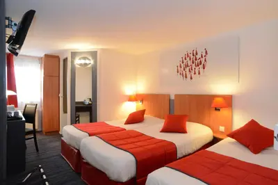 Un ou plusieurs lits dans un hébergement de l'établissement Hôtel Inn Design Dijon Est - Quetigny