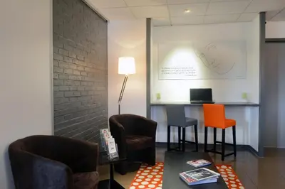 Coin salon dans l'établissement Hôtel Inn Design Dijon Est - Quetigny