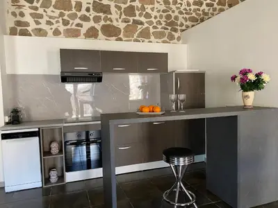 Cuisine ou kitchenette dans l'établissement Les Hauts de CLuny