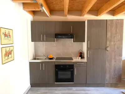 Cuisine ou kitchenette dans l'établissement Les Hauts de CLuny