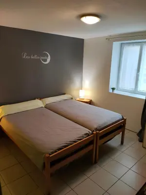 Un ou plusieurs lits dans un hébergement de l'établissement La ferme du Grand Faubourg