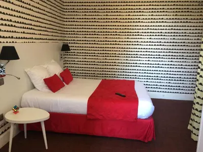 Un ou plusieurs lits dans un hébergement de l'établissement Hôtel Concorde