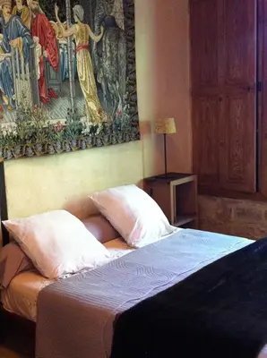 Un ou plusieurs lits dans un hébergement de l'établissement La chapelle du Domaine