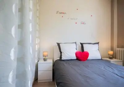Un ou plusieurs lits dans un hébergement de l'établissement SWEETHOME DIJON - Gare