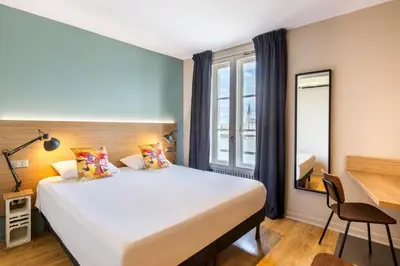 Un ou plusieurs lits dans un hébergement de l'établissement Hôtel du Nord