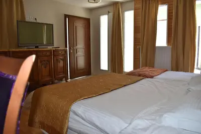 Un ou plusieurs lits dans un hébergement de l'établissement Hôtel Le Sauvage