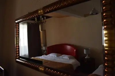 Un ou plusieurs lits dans un hébergement de l'établissement Hôtel Le Sauvage
