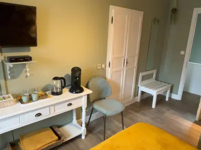 Télévision ou salle de divertissement dans l'établissement Auberge de La Chaloire