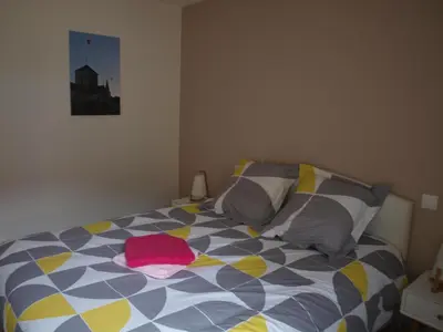 Un ou plusieurs lits dans un hébergement de l'établissement Cottage nuiton