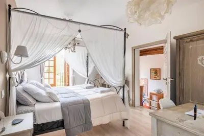 Un ou plusieurs lits dans un hébergement de l'établissement B&B Des Histoires d'Anges - Côté Jardin - Accueil Vélo