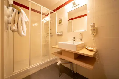 Salle de bains dans l'établissement Teritoria Hôtel Wilson