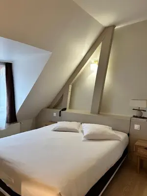 Un ou plusieurs lits dans un hébergement de l'établissement Le Relais de la Sans Fond