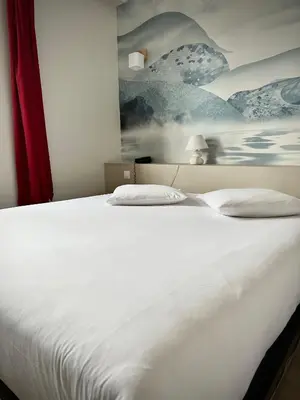 Un ou plusieurs lits dans un hébergement de l'établissement Le Relais de la Sans Fond