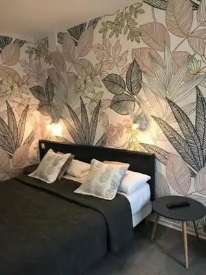 Un ou plusieurs lits dans un hébergement de l'établissement Hôtel Saint Philibert