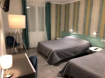 Un ou plusieurs lits dans un hébergement de l'établissement Hôtel Saint Philibert