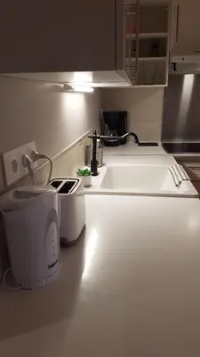Cuisine ou kitchenette dans l'établissement Beaune Residence appartement
