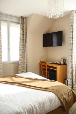 Un ou plusieurs lits dans un hébergement de l'établissement Hôtel Le Vouglans - Restaurant La Valouse