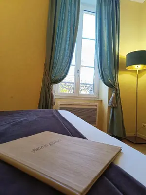 Un ou plusieurs lits dans un hébergement de l'établissement Hôtel La Reconce