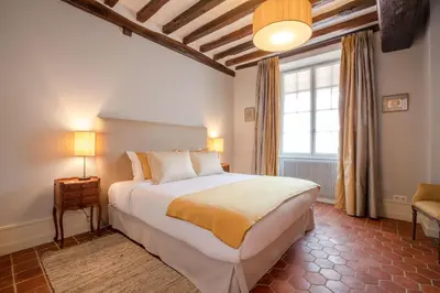 Un ou plusieurs lits dans un hébergement de l'établissement Les Demeures du Tonnelier ''La Maison Pini''