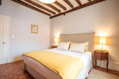 Un ou plusieurs lits dans un hébergement de l'établissement Les Demeures du Tonnelier ''La Maison Pini''
